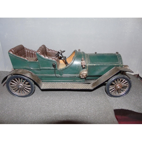 6 - A quality tinplate model of a vintage car with suspension etc. 51cm long