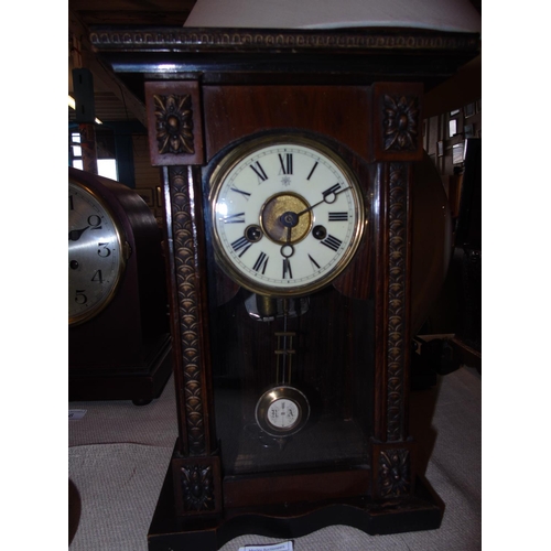 19 - An antique ceramic dial oak cased musical mantel/wall clock