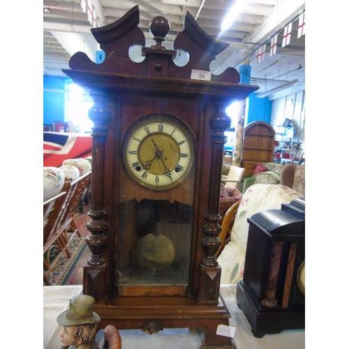 27 - A working Edwarian oak cased mantel clock