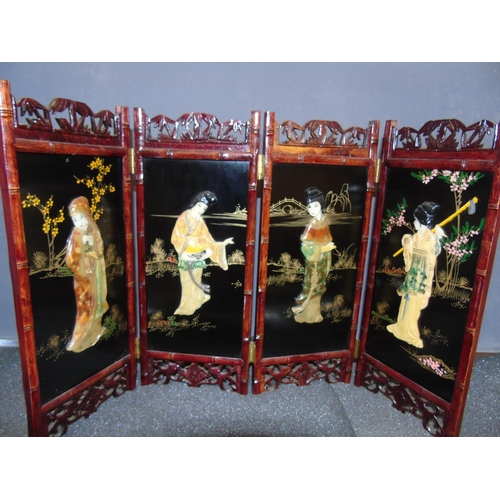 30 - A four sectioned and well decorated Chinese table screen 54cm x32cm, decorated with mop