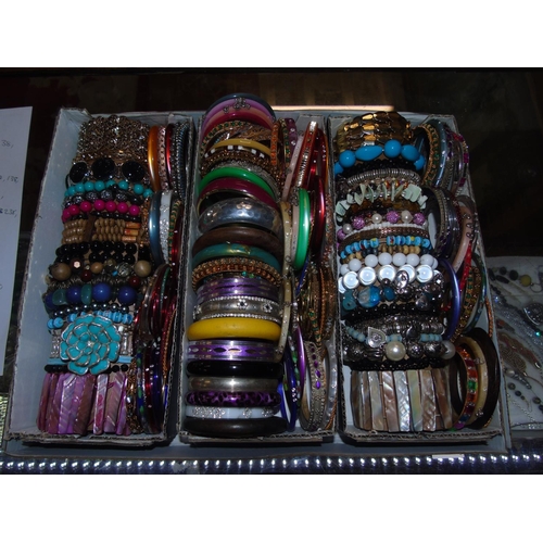 88 - A good tray of costume bangles