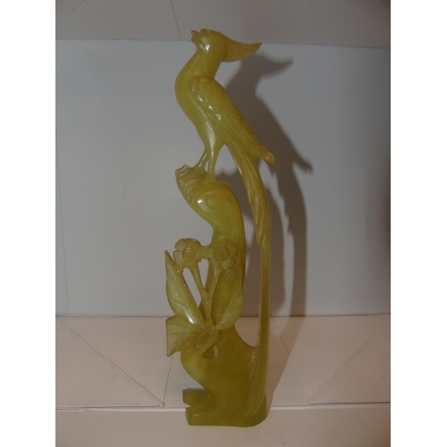 119 - A large carved Chinese jade sculpture of a bird in tree 26cm tall