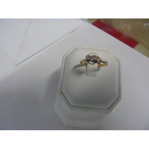 166 - A 9ct gold diamond trilogy ring size 0 3/4