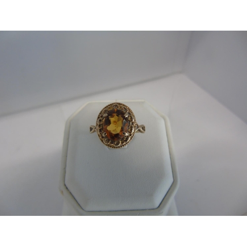 177 - A 9ct gold large oval citrine ring size R 1/2