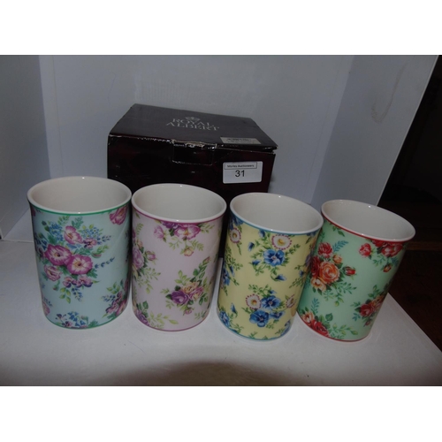 31 - A boxed set of four Royal Albert mugs