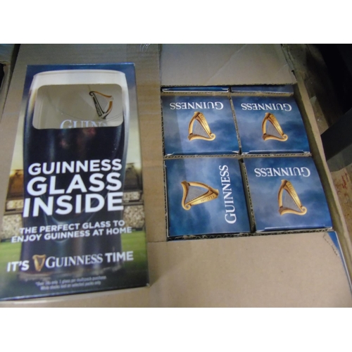 56 - A box of twenty four new boxed Guinness glasses