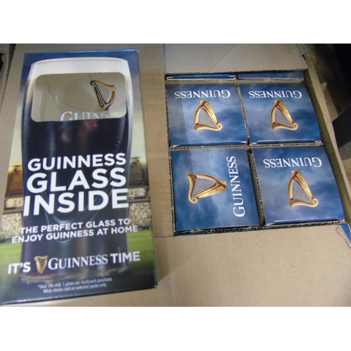 57 - A box of twenty four new boxed Guinness glasses