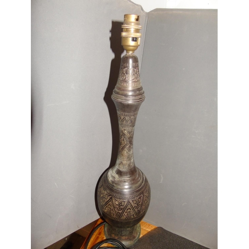 26 - A bronze lamp base with floral relief decoration. 54cm tall