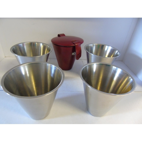 465 - A set of four stainless steel cups in a leather holder Norwegian made