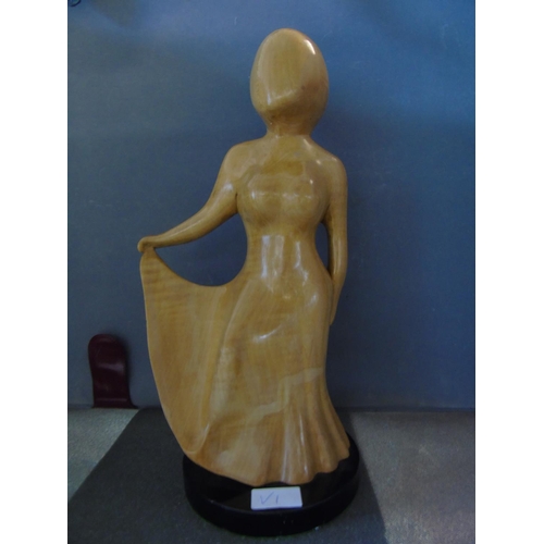 433 - A quality modernist wooden sculpture of a Lady on stand one piece 40cm tall