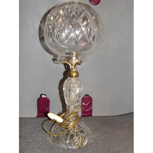 242 - A cut glass electric hurricane lamp (chip to shade). 44cm tall