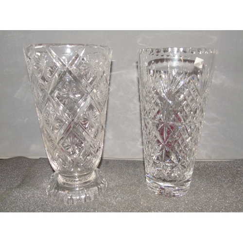 243 - Two good quality cut glass vases. 25cm tall