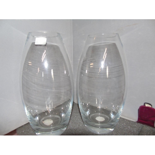 399 - Two contemporary glass vases. 30cm tall