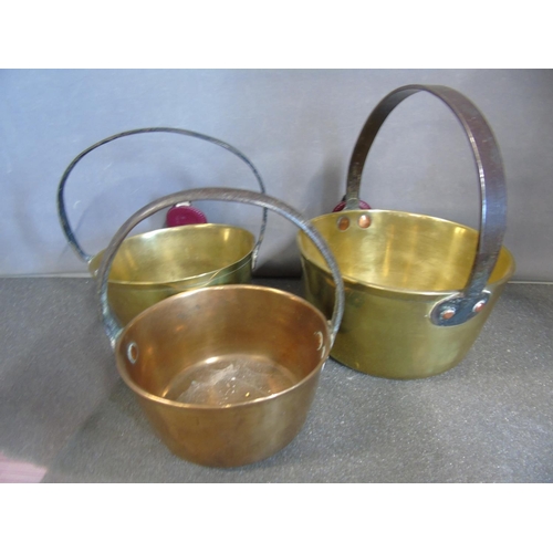 408 - Three graduated brass jam pans