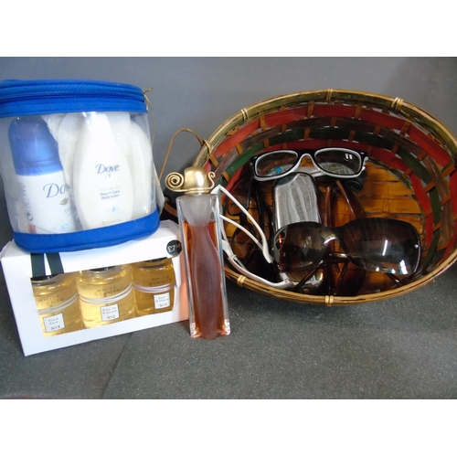 409 - A basket of cosmetics & sun glasses etc.