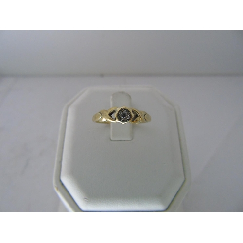 556 - A 9ct gold diamond solitaire ring size N