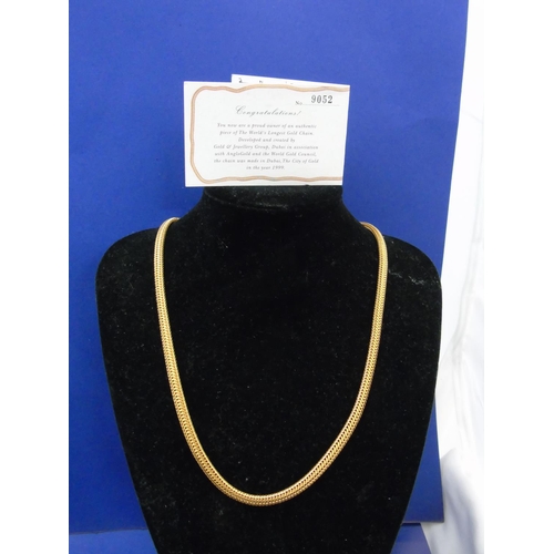 242 - A 22ct gold rope twist necklace which was made from  the World's longest chain in 1999 and produced ... 