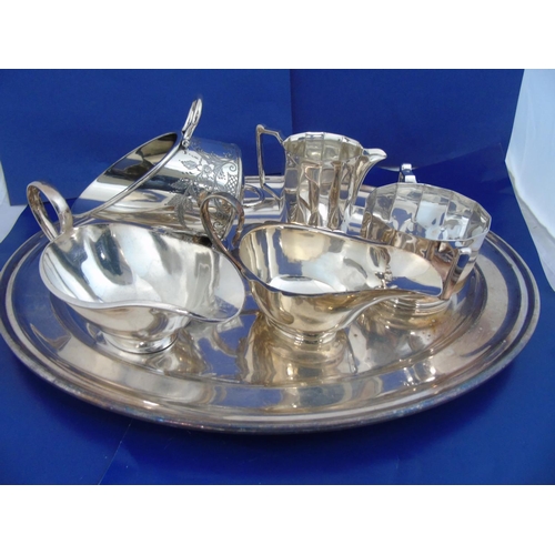 407 - A Silver plated salver & contents of plated ware