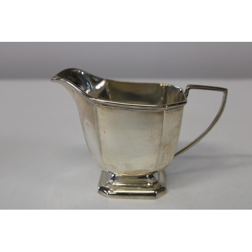 143 - A stamped silver jug (162 grams)