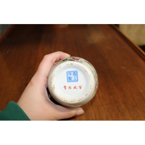 614 - A Chinese vase/cannister with peach tree decoration & marks to base (cannister is sealed)