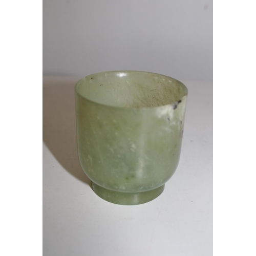 620 - An antique Chinese green jade tea bowl (small chip to the rim)