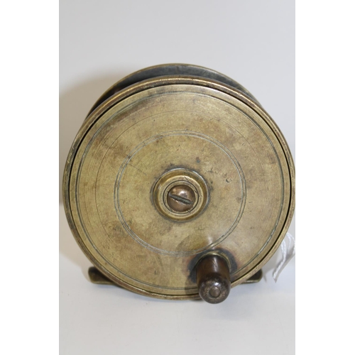 129 - A large vintage brass fishing reel