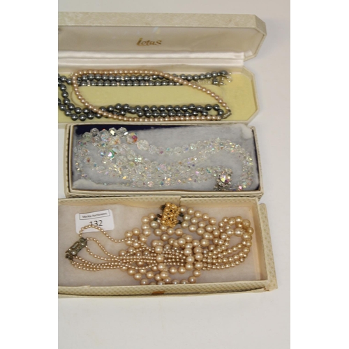 132 - A selection of boxed vintage necklaces etc