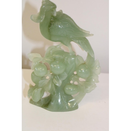 600 - A green jade bird sculpture 21cm tall