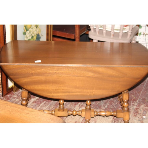 81 - An Ercol drop leaf coffee table
Collection Only. 1.05 metres x 0.90 meters with leaves extended