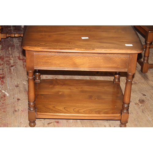 82 - An Ercol side table with draw
Collection Only. 67cm x 47cm