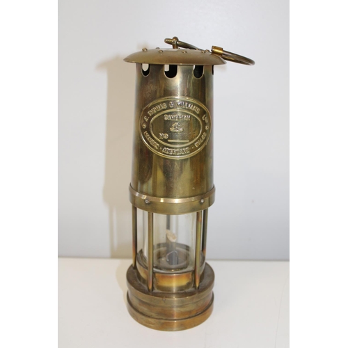 24 - A vintage brass miners lamp.
Height 25cm