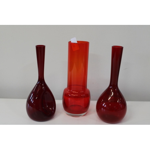 41 - Three pieces of stylish red art glass.
Height 25cm