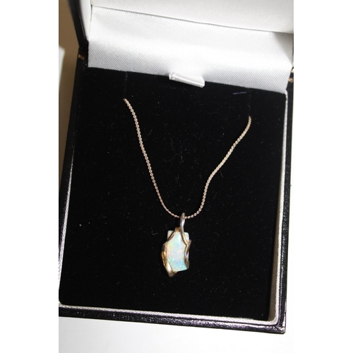 1063 - A 925 silver chain with silver & natural opal pendant