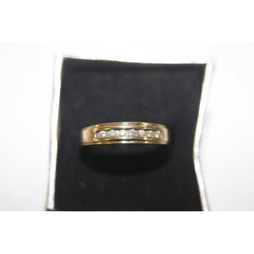 1068 - A 9ct gold & diamond half eternity ring size P 1/2