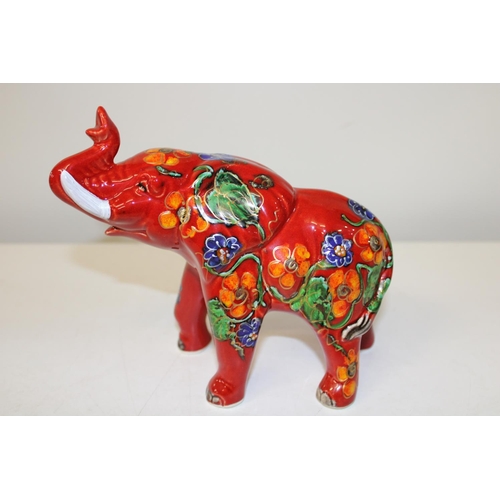 542 - A signed Anita Harris elephant figure 8 1/2 inches long x 7 1/2 inches tall