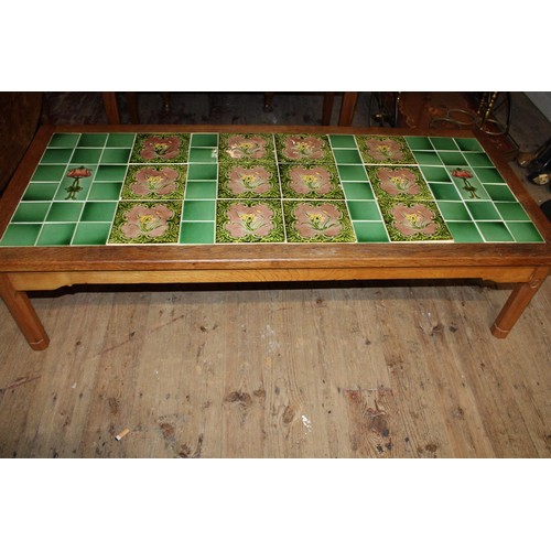 66A - A vintage oak coffee table with tiled insert by 