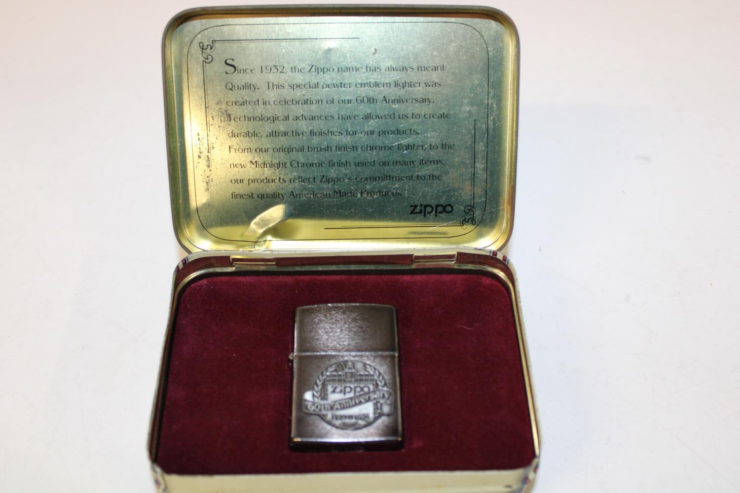 A boxed Zippo 60th anniversary lighter (Unused) 1932-1992