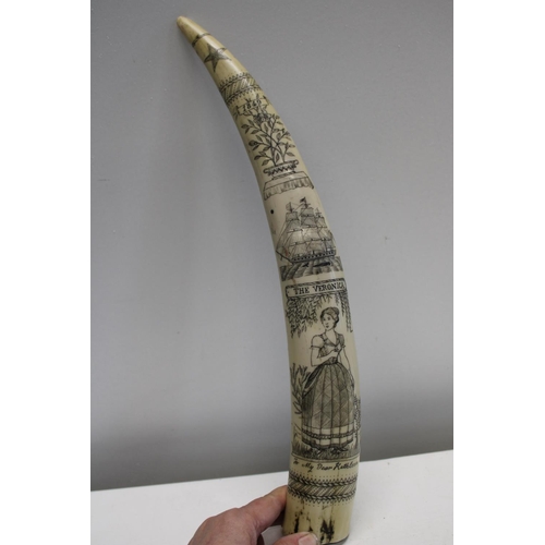 102 - A faux resin scrimshaw - approx 44cm long