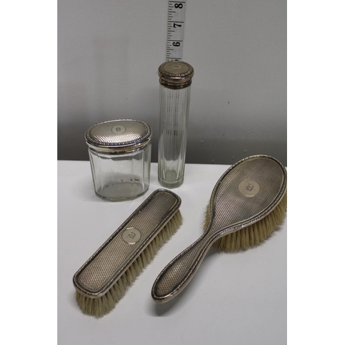 13 - A hallmarked silver dressing table set. Hallmarked for Birmingham 1928