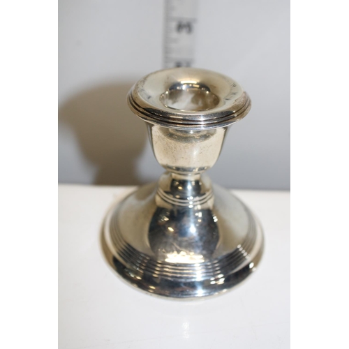 38 - A loaded squat silver candlestick hallmarked for Birmingham 1916. Gross weight 200 grams