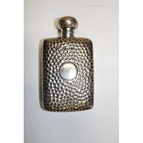 39 - A hallmarked silver hip flask. Hallmarked for Birmingham 1901. Weight 64 grams