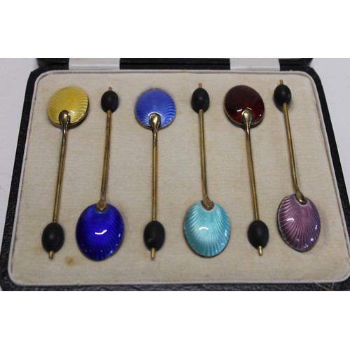 42 - A cased set of six hallmarked silver & gilt coffee spoons with guilloche enamel decoration. Hallmark... 