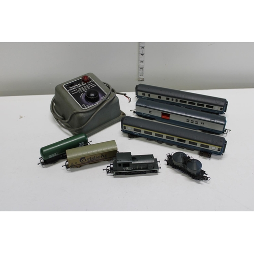 55 - A selection of assorted model train carriages and power control unit