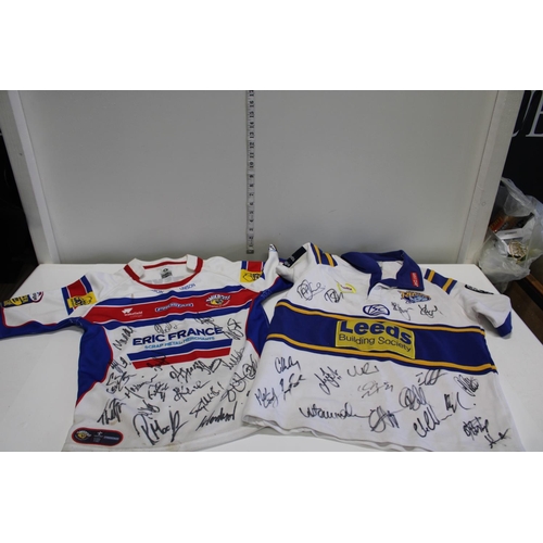 265 - A signed Leeds Rhino shirt & Wakefield Trinity shirt from the early 2000's