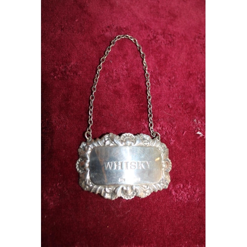 459 - A hallmarked silver whiskey decanter label