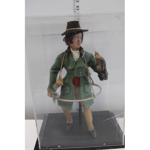 57 - An unusual cased model of a falconier