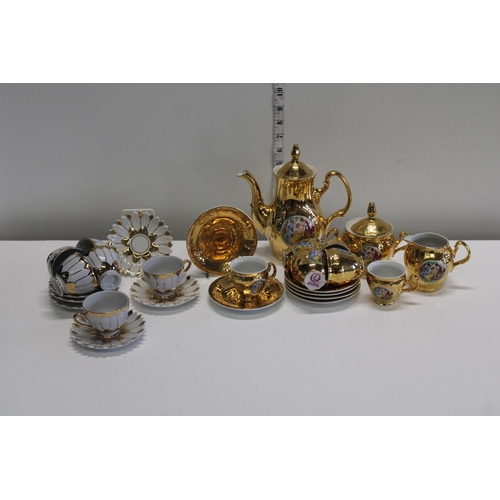 42 - A vintage European gilt coffee service and one other coffee set