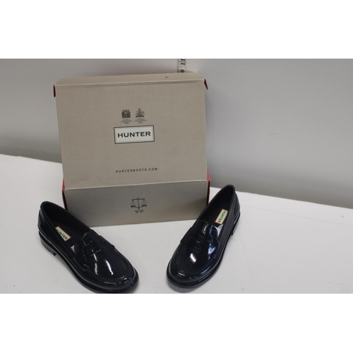 31 - A pair of Hunter Navy Loafers. Brand new in original box. Size 4