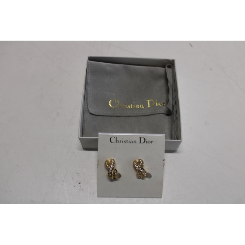 78 - A pair of Christian Dior Vintage Clip-on Criss-Cross Gold plated Earrings in original Neiman Marcus ... 