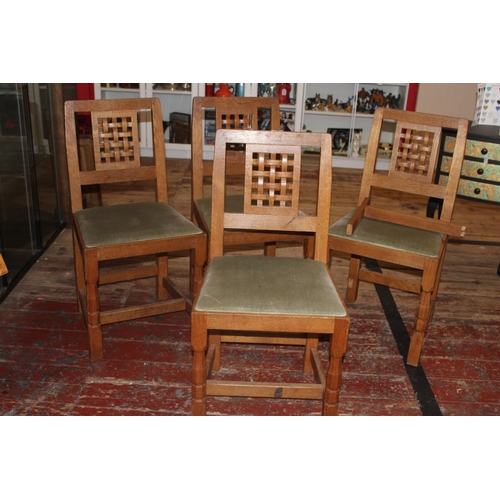 98 - Four vintage Derek 'Lizardman' Slater oak dining chairs with lattice work backs. All with a carved l... 